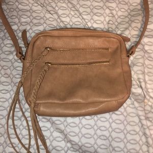a tan, rectangular cute purse from Cato.never used